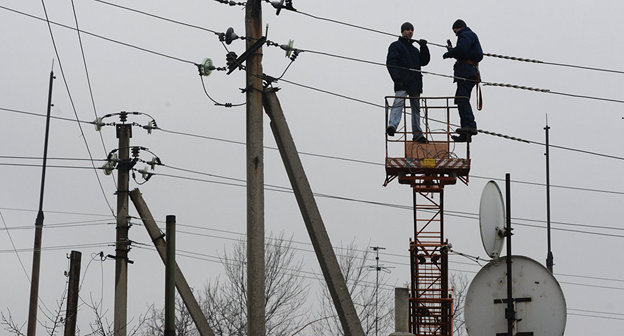Ыосстановление рабоы ЛЭП. Фото © Sputnik / Михаил Воскресенский http://sputnik-ossetia.ru/South_Ossetia/20150929/656064.html
