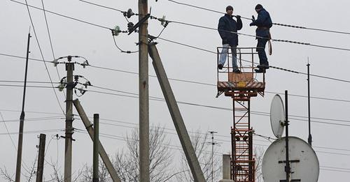 Ремонт линии электропередачи. Фото © Sputnik / Михаил Воскресенский


