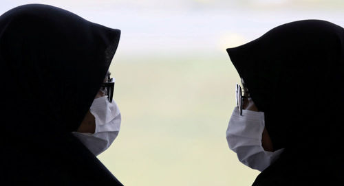 Люди в медицинских масках. Фото: REUTERS / LIM HUEY TENG
Люди в медицинских масках. Фото: REUTERS / LIM HUEY TENG