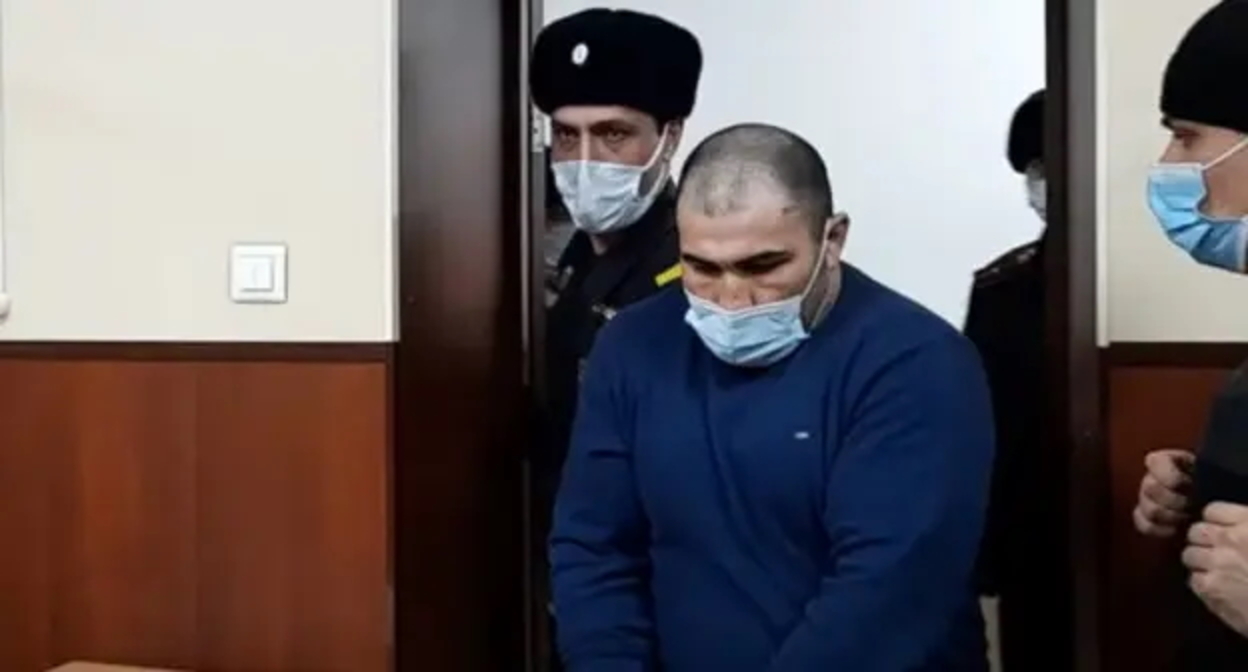 Один из братьев Курбановых в зале суда. стопкадр видео "Кавказского узла" https://www.youtube.com/watch?v=TaxYwlSWAC8&feature=emb_logo Один из братьев Курбановых в зале суда. стопкадр видео "Кавказского узла" https://www.youtube.com/watch?v=TaxYwlSWAC8&feature=emb_logo