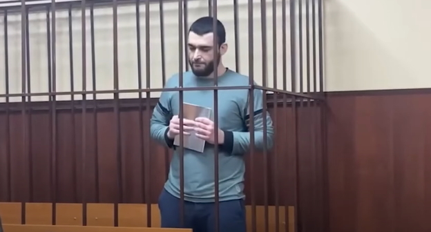Абдулмумин Гаджиев, стоп-кадр видео канала ROMB, https://www.youtube.com/watch?v=0jex6a8-VIg Абдулмумин Гаджиев, стоп-кадр видео канала ROMB, https://www.youtube.com/watch?v=0jex6a8-VIg